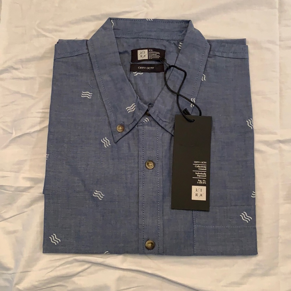 Lira. Blue w/white wave, short sleeve button down.